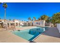 Community swimming pool with surrounding patio area at 1800 Edmond St # 124, Las Vegas, NV 89146