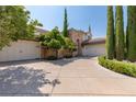 Elegant home with a large driveway and nicely landscaped yard at 1975 Alcova Ridge Dr, Las Vegas, NV 89135