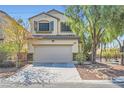 Charming two-story home with a well-maintained front yard, attached two-car garage and a welcoming curb appeal at 2905 Vigilante Ct, North Las Vegas, NV 89081