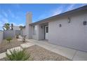 Front entrance of the house with walkway and landscaping at 4401 Mossy Rock Ct, Las Vegas, NV 89108