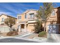 Charming two-story home with a well-maintained front yard and attached garage in a desirable neighborhood at 11135 Abbeyfield Rose Dr, Henderson, NV 89052