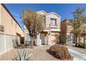 Charming two-story home with a well-maintained front yard and attached garage in a desirable neighborhood at 11135 Abbeyfield Rose Dr, Henderson, NV 89052
