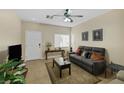 Inviting living room featuring neutral tones, comfortable seating, and stylish decor, perfect for relaxation and entertaining at 11135 Abbeyfield Rose Dr, Henderson, NV 89052