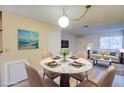 Charming dining area featuring a modern table and adjacent living space at 1303 Darlene Way # 105C, Boulder City, NV 89005