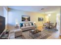 Bright living room with staged furniture and plenty of natural light at 1303 Darlene Way # 105C, Boulder City, NV 89005
