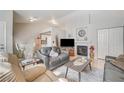 Comfortable living room with fireplace and adjacent dining area at 1608 N Torrey Pines Dr # 104, Las Vegas, NV 89108