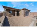 Attractive single-story home exterior with brick accents and a low-maintenance landscape at 1835 Kinglake St, Henderson, NV 89044