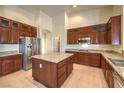 Island kitchen with granite countertops and wood cabinets at 6412 Moss Agate Dr, Las Vegas, NV 89131
