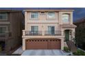 Two-story house with attached two-car garage and balcony at 10658 Salmon Leap St, Las Vegas, NV 89183