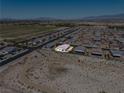 Expansive aerial view of a residential community with mountain views at 3543 E Wallowa Dr, Pahrump, NV 89061