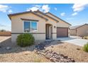 Inviting single-story home with desert landscaping and a two-car garage at 3543 E Wallowa Dr, Pahrump, NV 89061
