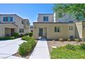 Modern townhome with attractive landscaping and walkway at 3634 Tripoli Cove Ave, Las Vegas, NV 89106