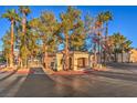 Beautiful community pool area surrounded by mature trees and lush landscaping at 3950 S Sandhill Rd # 112, Las Vegas, NV 89121