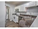Efficient kitchen featuring stainless steel appliances, granite countertops, and modern cabinetry at 3950 S Sandhill Rd # 112, Las Vegas, NV 89121