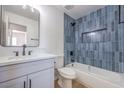 Stylish bathroom, featuring a blue tiled shower/tub combo at 617 Carpenter Dr, Las Vegas, NV 89107