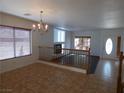 Dining area with tiled floors and a view of the living room at 6604 Octave Ave, Las Vegas, NV 89139