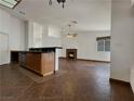Bright, open living area with tile floors and a cozy fireplace at 840 Candido Garcia Ave, Henderson, NV 89015
