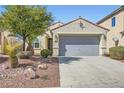 Inviting single-story home with a well-maintained front yard, desert landscaping, and a two-car garage at 8633 Sherwood Park Dr, Las Vegas, NV 89131