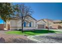 Well-maintained single-story home with desert landscaping and a spacious two-car garage in a desirable neighborhood at 9843 Wonderful Day Dr, Las Vegas, NV 89148