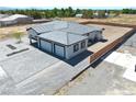 Aerial shot highlighting the home's large paver driveway and xeriscaped front yard at 1691 Blackhorn St, Pahrump, NV 89048