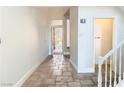 Welcoming entryway with tiled floor, staircase access, and direct view of the front exterior at 24 Cerchio Alto, Henderson, NV 89011