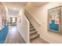 Bright hallway with staircase leading upstairs at 2550 Petunia Garden Ave # 219, North Las Vegas, NV 89081