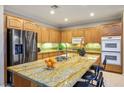 Spacious kitchen island with granite countertops, stainless steel appliances, and ample cabinetry at 3146 Surf Spray St, Las Vegas, NV 89117