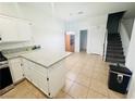 Open concept kitchen and dining area with island and staircase at 3205 Mystic Ridge Ct, Las Vegas, NV 89129