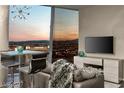 Cozy living area with city views, a stylish table, comfortable seating, and modern decor at 3722 Las Vegas Blvd # 3209, Las Vegas, NV 89158