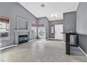 Living room with fireplace, tile floors, and built-in bar at 3757 Grand Viewpoint Ct, Las Vegas, NV 89147