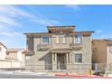 Two-story house with a neutral color scheme and a landscaped yard at 4050 Sparrow Rock St, Las Vegas, NV 89129