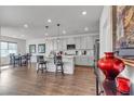 Open concept kitchen with a center island, stainless appliances, and pendant lighting at 4267 E Highvale Ct, Pahrump, NV 89061