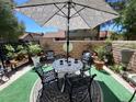 Relaxing patio featuring a table, chairs, and umbrella at 4537 Buena Vista Dr, Las Vegas, NV 89102