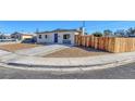 Charming home features desert landscaping, concrete driveway, and updated exterior at 704 Berry Cir, Las Vegas, NV 89107