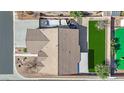 Aerial view of a home, showing the roof, boat, and green backyard at 7912 Rushmore Ave, Las Vegas, NV 89131