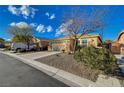 Charming single story home with a two car garage and desert landscaping at 7992 Barntucket Ave, Las Vegas, NV 89147