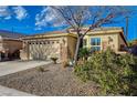 Charming single story home with a two car garage and desert landscaping at 7992 Barntucket Ave, Las Vegas, NV 89147