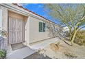 Inviting front entrance with a secure gate and a well-maintained walkway leading to the front door at 8201 Lake Isle Ct, Las Vegas, NV 89145