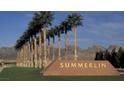 Entrance to the Summerlin community featuring a sign and palm trees with mountains in the background at 85 Alerion St, Las Vegas, NV 89138