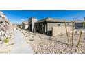 Neighborhood street view highlighting modern home designs and tidy desert landscaping at 889 Elmwood Forest Ln, Las Vegas, NV 89138