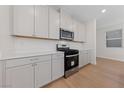 Stainless steel appliances and gray cabinets in a modern kitchen at 9062 Lucky Crest St, Las Vegas, NV 89113