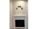 A close-up of the white modern fireplace in the living room at , Henderson, NV 89014