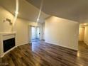 Open living area featuring wood floors, modern fireplace, and sliding glass door to the outside at , Henderson, NV 89014