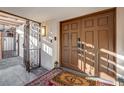 Elegant double door entryway with decorative gate, lantern sconce, and stylish welcome mat at , Las Vegas, NV 89109