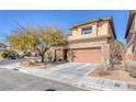 Two-story house with stone accents and a two-car garage at 10212 Cider Mill Rd, Las Vegas, NV 89135