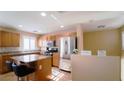 Modern kitchen with stainless steel appliances and granite countertops at 1300 Sand Castle Ave, Las Vegas, NV 89183