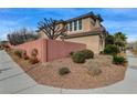 Charming two-story home featuring stucco exterior, tile roof, desert landscaping, and mature trees at 1381 Robard St, Las Vegas, NV 89135