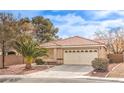 Charming single-story home with a well-manicured lawn and a two-car garage at 2153 Hookcross Cir, Henderson, NV 89074