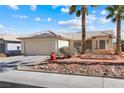 Charming single-story home with desert landscaping and a two-car garage at 3910 Cheryl Clay Way, North Las Vegas, NV 89032