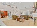 Bright living room features an open floor plan, staircase, and hardwood floors at 4200 Topsider St, Las Vegas, NV 89129